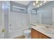 Well-lit bathroom with vanity, bath tub, and tile flooring at 5078 Rivedro St, Las Vegas, NV 89135