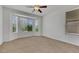 Bright bedroom has bay window and neutral walls and carpet at 5078 Rivedro St, Las Vegas, NV 89135