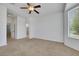 Bright bedroom featuring neutral carpet and an ensuite bathroom at 5078 Rivedro St, Las Vegas, NV 89135