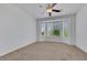 Bright bedroom features neutral carpet, ceiling fan, and bay windows at 5078 Rivedro St, Las Vegas, NV 89135