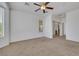 Spacious bedroom featuring neutral carpet and a ceiling fan at 5078 Rivedro St, Las Vegas, NV 89135