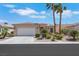 Charming single-story home features desert landscaping, an attached two-car garage, and a tiled roof at 5078 Rivedro St, Las Vegas, NV 89135