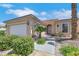 Charming single-story home features desert landscaping, an attached two-car garage, and a covered entry at 5078 Rivedro St, Las Vegas, NV 89135