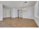 Bright living room with tile and carpet flooring, recessed lights, and view to the front entrance at 5078 Rivedro St, Las Vegas, NV 89135