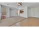 Bright living room featuring neutral walls, carpet, a ceiling fan, and an open layout at 5078 Rivedro St, Las Vegas, NV 89135
