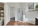 Bathroom with tile floors, glass-door shower and tub combo and a toilet with a shelving unit at 520 Blackbird Knoll Ct, North Las Vegas, NV 89084