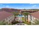 Beautiful resort condos overlook a pool, shuffleboard, and lounge area, creating an ideal desert retreat with amazing views at 555 Highland Dr # 203, Mesquite, NV 89027