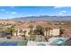 Wonderful view of resort-style condos overlooks a pool, shuffleboard area, and tennis court creating a vibrant community at 555 Highland Dr # 203, Mesquite, NV 89027