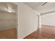 Spacious bedroom featuring wood-look flooring, closet and multiple doorways at 555 Highland Dr # 203, Mesquite, NV 89027