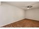 Spacious bedroom featuring wood-look flooring and a ceiling fan at 555 Highland Dr # 203, Mesquite, NV 89027