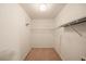 Walk-in closet featuring wire shelving and neutral carpeting at 555 Highland Dr # 203, Mesquite, NV 89027