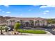Inviting multi-story building boasts beautiful landscaping and palm trees, offering a serene and attractive environment at 555 Highland Dr # 203, Mesquite, NV 89027
