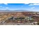 Resort featuring desert landscaping with red tiled roofs perched atop a hillside against a mountainous backdrop at 555 Highland Dr # 203, Mesquite, NV 89027