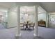 Charming hallway sitting area with classic columns, elegant lighting and cozy seating arrangement at 555 Highland Dr # 203, Mesquite, NV 89027