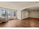 Spacious living room with hardwood floors, natural light, and an archway at 555 Highland Dr # 203, Mesquite, NV 89027