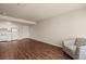 Open-concept living room with kitchen, hardwood floors and neutral tones at 555 Highland Dr # 203, Mesquite, NV 89027