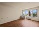 Comfortable living room with a view, hardwood floors, and an armchair at 555 Highland Dr # 203, Mesquite, NV 89027