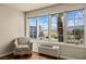Bright room featuring a large window with mountain views, chair, and an air conditioning unit at 555 Highland Dr # 203, Mesquite, NV 89027