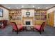 A cozy lounge features built-in shelving and a fireplace at 555 Highland Dr # 203, Mesquite, NV 89027