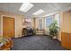 Bright office space with natural light, work area, and neutral decor at 555 Highland Dr # 203, Mesquite, NV 89027