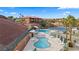 Wonderful aerial showcases pool and spa surrounded by inviting lounge chairs, with beautiful hillside resort condos at 555 Highland Dr # 203, Mesquite, NV 89027