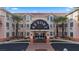 Inviting resort entrance with palm trees, well-manicured landscaping and ample parking at 555 Highland Dr # 203, Mesquite, NV 89027