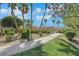 Pathway to the community dog park featuring mature landscaping and a pet waste station at 5553 High Wager Way # 101, Las Vegas, NV 89122