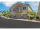 Beautiful condo building featuring attached garages, neutral colors, and modern design at 5553 High Wager Way # 101, Las Vegas, NV 89122