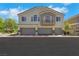 Well-maintained two-story condo featuring attached garages and balcony at 5553 High Wager Way # 101, Las Vegas, NV 89122