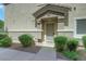 Charming front entrance with well-maintained landscaping and stone accents at 5553 High Wager Way # 101, Las Vegas, NV 89122