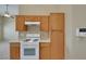 This kitchen features ample cabinet space and a white range at 5553 High Wager Way # 101, Las Vegas, NV 89122