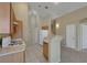 A partial view of a kitchen with linoleum floors and ample cabinet space at 5553 High Wager Way # 101, Las Vegas, NV 89122