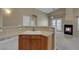 A partial view of the kitchen features a linoleum floor, dishwasher and ample cabinet space at 5553 High Wager Way # 101, Las Vegas, NV 89122