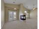 Spacious living room features a corner fireplace and sliding door to the outside at 5553 High Wager Way # 101, Las Vegas, NV 89122