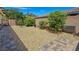 Backyard featuring gravel landscaping, stone pavers and mature landscaping, provides a serene outdoor space at 6975 Hopi Summit Ct, Las Vegas, NV 89149
