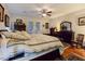 Spacious bedroom featuring hardwood floors, natural light, and an ensuite bathroom offering comfort and privacy at 6975 Hopi Summit Ct, Las Vegas, NV 89149