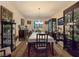 Formal dining room with table, chairs, carpet and two curios at 6975 Hopi Summit Ct, Las Vegas, NV 89149