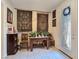 Foyer with tile floor, beautiful front door, console table and sconces at 6975 Hopi Summit Ct, Las Vegas, NV 89149