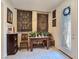 Foyer with tile floor, beautiful front door, console table and sconces at 6975 Hopi Summit Ct, Las Vegas, NV 89149