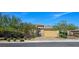 Charming single-story home features a two-car garage, beautiful desert landscaping, and gated entry at 6975 Hopi Summit Ct, Las Vegas, NV 89149