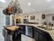 Well-equipped kitchen island featuring a sink, dishwasher, and plenty of counter space for meal preparation at 6975 Hopi Summit Ct, Las Vegas, NV 89149