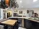Well-equipped kitchen island featuring a sink, dishwasher, and plenty of counter space for meal preparation at 6975 Hopi Summit Ct, Las Vegas, NV 89149