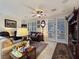 Comfortable living room with tile floors, large windows, and ample seating for relaxation and entertainment at 6975 Hopi Summit Ct, Las Vegas, NV 89149