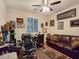 Comfortable office space with natural light, a desk, and a leather sofa, ideal for work or relaxation at 6975 Hopi Summit Ct, Las Vegas, NV 89149