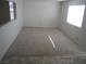 Carpeted bedroom with natural light from two windows at 7309 Sunspot Dr, Las Vegas, NV 89128