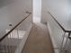 Upstairs hallway featuring carpet flooring and natural lighting at 7309 Sunspot Dr, Las Vegas, NV 89128