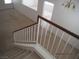 Carpeted staircase with white railings leading to the first floor at 7309 Sunspot Dr, Las Vegas, NV 89128