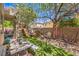 Spacious backyard featuring a play structure, seating area, and artificial turf at 7352 Rietz Canyon St, Las Vegas, NV 89131