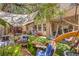 Inviting backyard featuring a lush lawn, comfortable seating, a playground, and shade from mature trees at 7352 Rietz Canyon St, Las Vegas, NV 89131