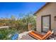 Relaxing outdoor balcony with lounge seating and a view of the surrounding landscape at 7352 Rietz Canyon St, Las Vegas, NV 89131